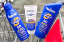 three coppertone sunscreens in a shopping cart