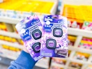 2 Febreze Air Freshener Car Vent Clips being held up in Walmart store
