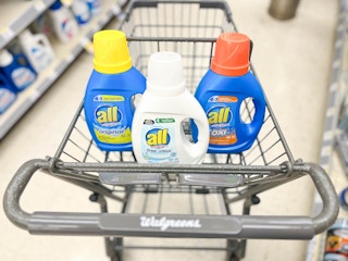 shopping cart with three bottles of All laundry detergent inside