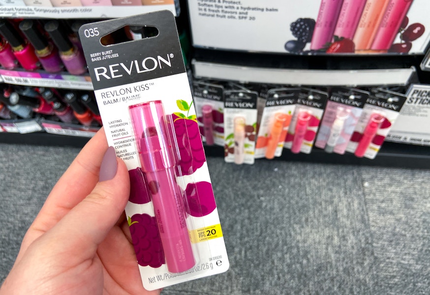 hand holding a Revlon Kiss Balm