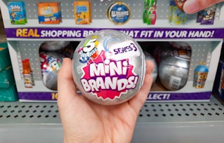 hand holding zuru 5 surprise mini brands at walmart