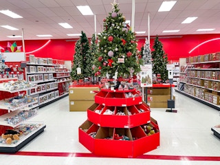 An area shot of Christmas Trees in the holiday section of a store.