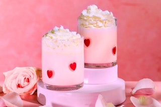 Lifestyle image of Thyme and Table Valentine's Day Drinking Glass Set with roses in the background