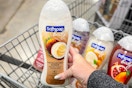 hand holding a bottle of softsoap body wash