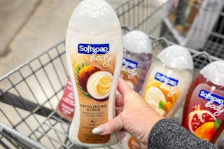 hand holding a bottle of softsoap body wash