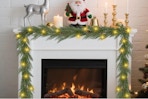 Artgar Christmas Cedar Garland draped over a hearth.