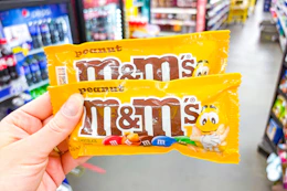 hand holding m&m's candies