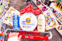 cinnamon toast crunch cereal, safeguard hand soap, tide pods, aveeno lotion, and colgate toothpaste in a cart