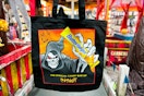 the spirit halloween free tote bag with their logo mascot holding a butterfinger candy bar