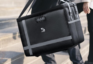 person carrying box