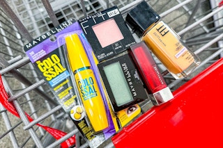 maybelline mascara, eyeshadow, blush, foundation, and lipstick in a cart