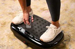 a woman using a vibration plate