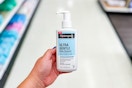 hand holding neutrogena facial cleanser