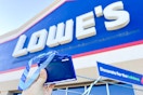 someone holding up the free lowe's ornament
