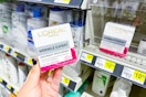 hand holding l'oreal wrinkle expert moisturizer