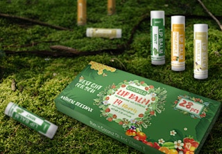 a pack of lip balm in the grass