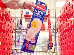 hand holding an o-cedar duster kit in a target cart