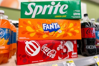 three soda packs on store shelf