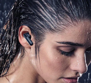 a person wearing earbuds in their ear