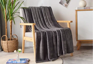 fleece throw blanket sitting on a chair