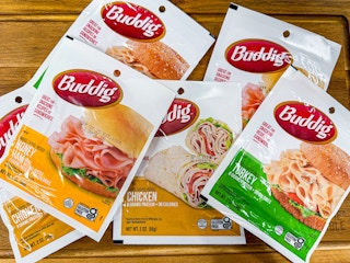 six packs of buddig lunch meat on table at walmart