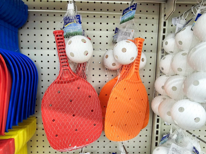 2 kids pickleball sets hanging on a display