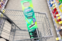 swiffer deluxe sweep and mop kit in a cart