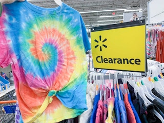 no boundaries tie die tee shirt held up by clearance sign on top of circular walmart rack