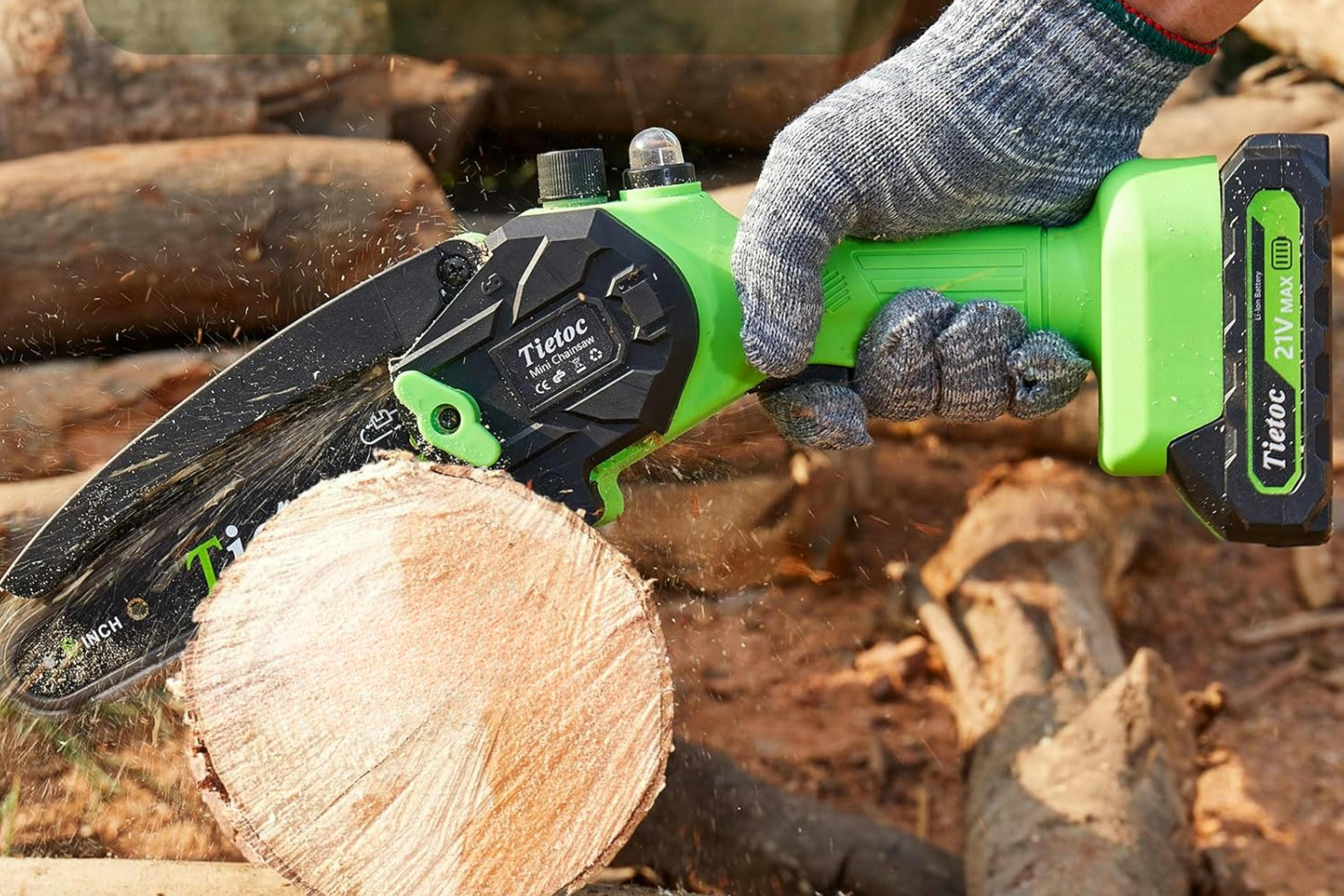 Person using the  Tietoc Chainsaw 6 Inch Mini Electric Chainsaw on a log.