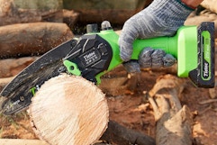 Person using the  Tietoc Chainsaw 6 Inch Mini Electric Chainsaw on a log.