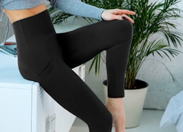 a person wearing legging while standing in a living room