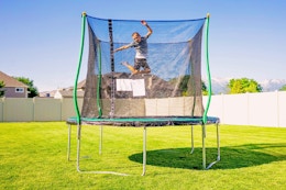 Lifestyle image of the Bounce Pro 10' Trampoline outdoors