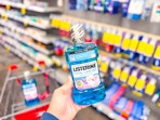 hand holding listerine kids mouthwash