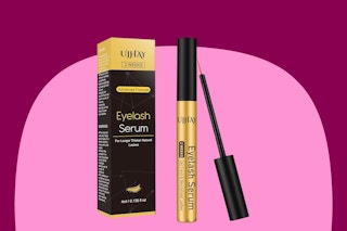 A box and tube (with extra brush applicator to show it) of eyelash serum. The tube is gold with a black lid.