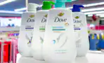 dove pump body wash bottles on a shelf