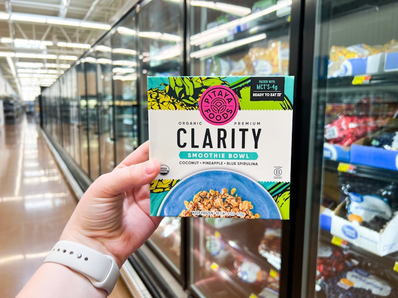 hand holding pitaya foods clarity smoothie bowl in frozen aisle at walmart