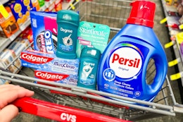 colgate toothpaste, degree deodorant, oreo cookies, skintimate razors, and persil detergent in a cart