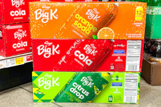 big k soda 12-packs stacked on floor