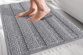 a person stepping on a bath mat