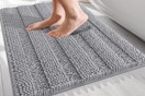 a person stepping on a bath mat