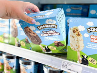 hand grabbing a box of ben & jerry's ice cream bars off a target shelf