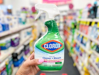 hand holding bottle of Clorox cleaner and bleach spray