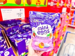 hand holding a bag of cadbury mini eggs at sams club