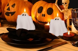 ghost candle on halloween themed table display