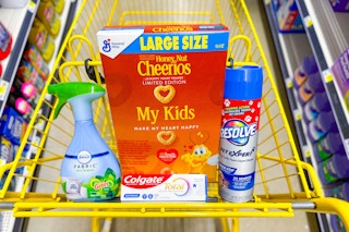 cheerios, febreze, colgate, and resolve products in a dollar general shopping cart