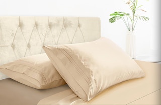 two beige pillows on a bed