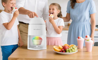 a family eating snow cones near a snow cone machine