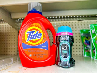 tide detergent and downy unstoppables on a shelf