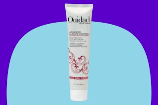 Ouidad styling hair cream on a blue background.