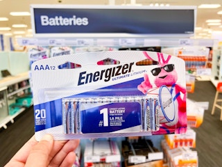 hand holding up a package of Energizer batteries at Target